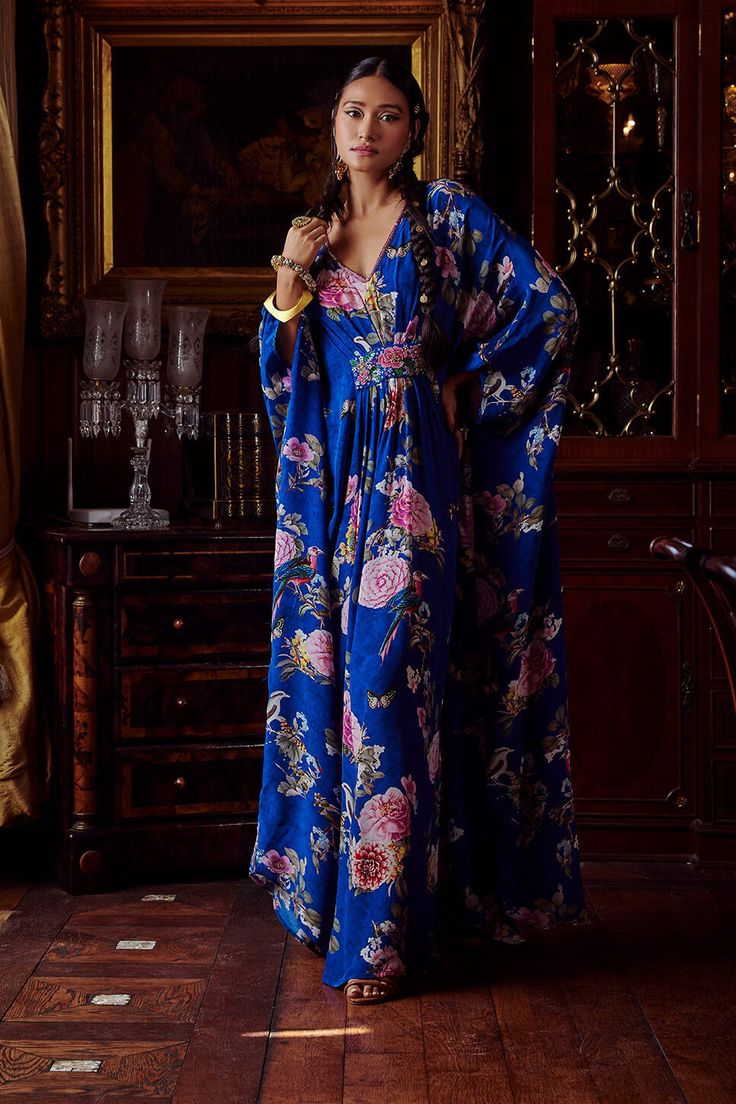 Editor's Note Featuring a hand painted and printed kaftan in fresh and vibrant crepe. It has an embellished detail gathered on the front. Fabric: Crepe Color: Blue Components: Kaftan Occasion: Daywear and resort Disclaimer: Product color may slightly vary due to photographic lighting sources or your monitor setting. Care: Dry Clean Only About the Designer Kalista is a luxury fashion label that specializes in designer clothing for millennial women. Founded by fashion designer turned entrepreneur, Indian Editorial, Blue Kaftan, Luxury Aesthetics, Sarees Traditional, Kaftan For Women, Embroidered Shirt Dress, Short Kaftan, Fashion Sarees, Fashion Menswear