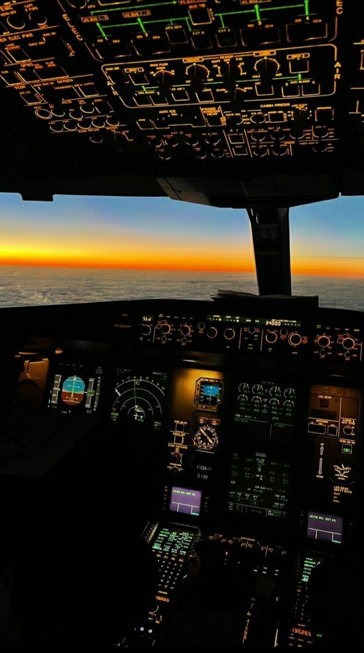 the view from inside an airplane at sunset