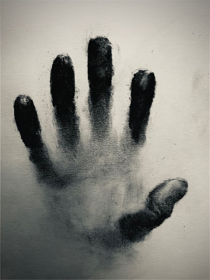 a black and white photo of a hand