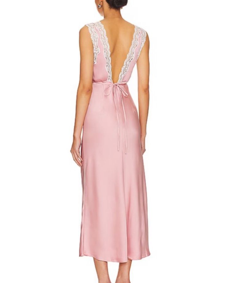 Step into enchantment with the Lovers and Friends Jordan Midi Dress in Baby Pink. With its satin and lace trim, soft-girl style has never looked more chic. Elevate your elegance now. Self: 100% polyester Trim: 100% nylon Made in China Dry clean only Unlined Hidden back zipper and tie closure Lightweight satin fabric with lace trim Satin V-neck Dress With Lace Bodice, Elegant Silk Dress With Lace Trim, Chic Pink Slip Dress With Lace Trim, Spring Formal Slip Dress With Lace Trim, Daywear Satin Dress With Lace Trim, Formal Feminine Slip Dress With Lace Trim, Feminine Silk Dress With Lace Trim, Satin Dresses With Lace Trim For Daywear, Sleeveless Silk Dress With Lace Trim