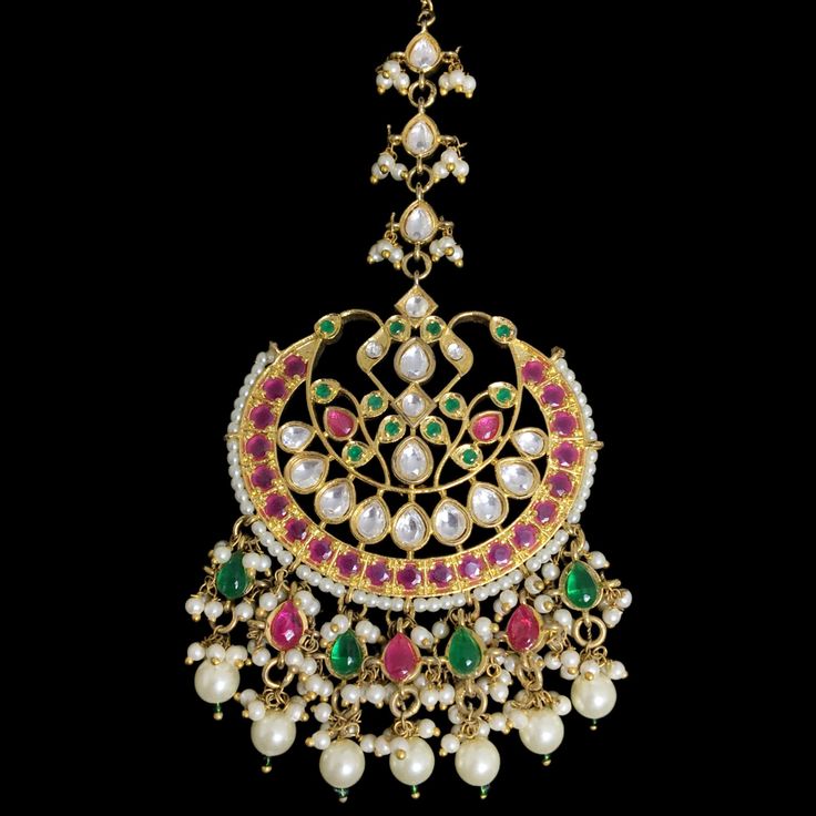 Multi Color FINEST Quality Bridal look with this stunning Maang Tikka, featuring Kundan and Navratan Polki stones set in gold-plated Jadau. Its intricate design and big, statement piece create a regal touch perfect for weddings. Ideal for Pakistani and Indian ceremonies, this forehead accessory adds elegance and tradition to any hairstyle. *𝐏𝐑𝐎𝐃𝐔𝐂𝐓 𝐃𝐄𝐓𝐀𝐈𝐋* * Material: Brass * Plating:   Gold Plated * Stone: Semi Precious Kundan, Polki & Pearls. *DIMENSIONS * * Weight: 28 gm EACH * L Saree Sharara, Gold Maang Tikka, Maang Tikka Kundan, Tikka Jewelry, Jewelry Pakistani, Sabyasachi Jewellery, India Wedding, Maang Tikka, Celebrity Engagement Rings