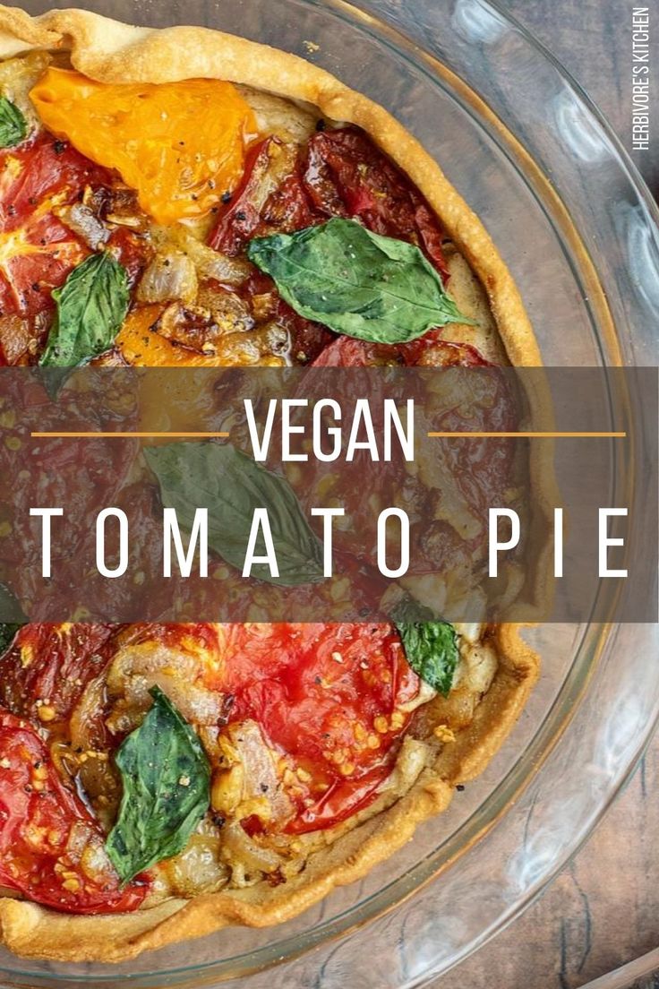 vegan tomato and spinach pie on a glass plate with the words vegan automato pie above it