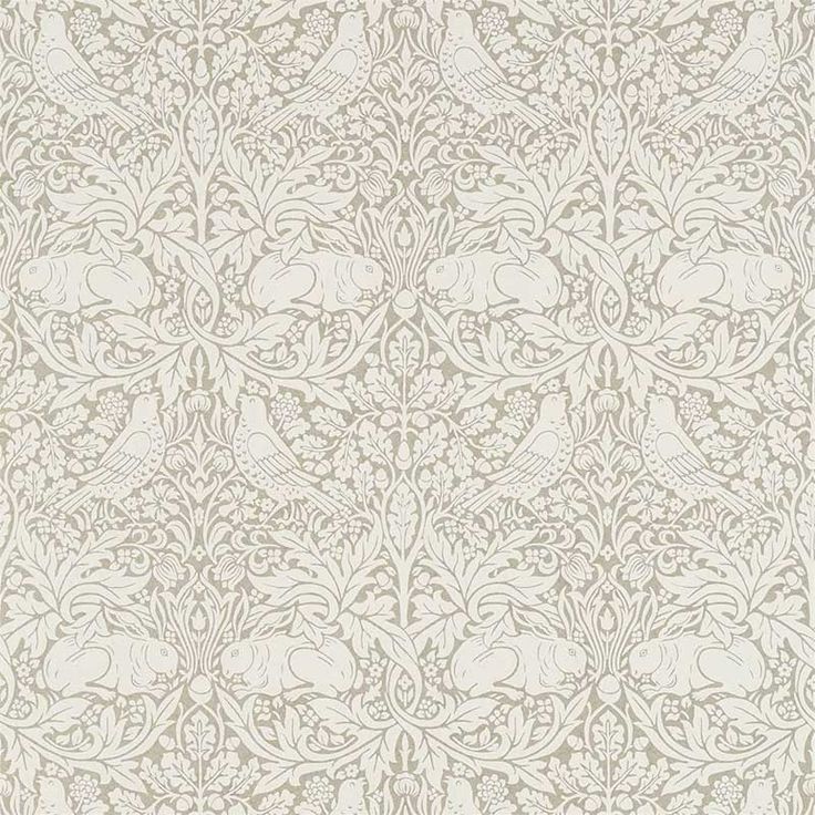 an ornate wallpaper with white flowers and leaves