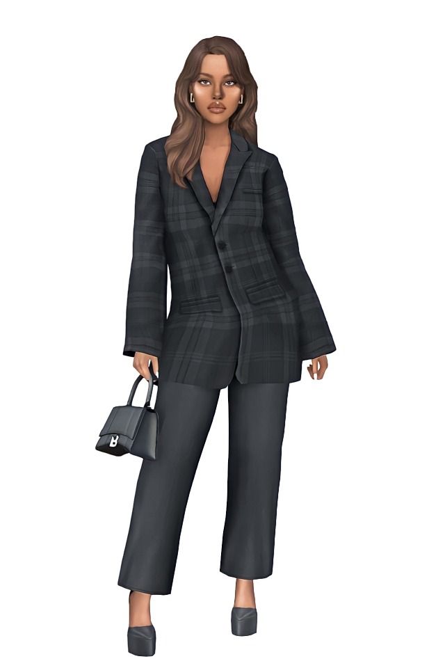 a woman wearing a suit and holding a purse in one hand while standing on a white background