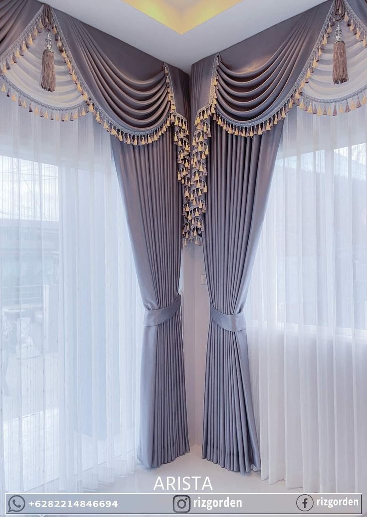 the curtains in this room are drapes with beaded trimmings on them