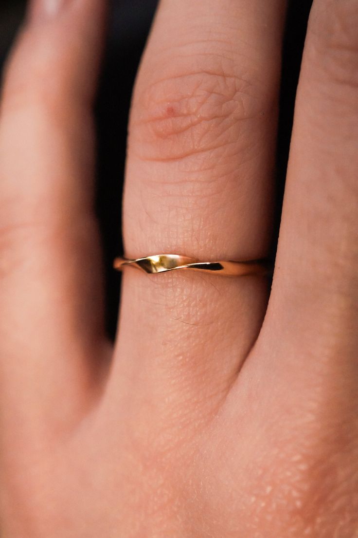 The Möbius Band features a continuous wave design that embodies unity and infinity. The ring is handcrafted out of a D-shaped (half round) metal, featuring a single ribbon-like wave. This listing is for ONE single ring in  14K Gold Fill. The thickness of the metal used with this ring measures approximately 2mm which gives this piece a durable and sturdy design while maintaining that effortless look. While this ring is gorgeous on its own, we think it makes a lovely stack when combined with the Minimalist Twisted Jewelry For Anniversary, Gold Curved Rings For Gifts, Curved Gold Rings For Gifts, Gold Curved Rings For Gift, Curved 14k Gold Jewelry For Anniversary, Gold Wavy Rings For Anniversary, 14k Gold Curved Jewelry For Anniversary, Modern Wavy Jewelry For Anniversary, Twisted 14k Gold Rings With Modern Twist