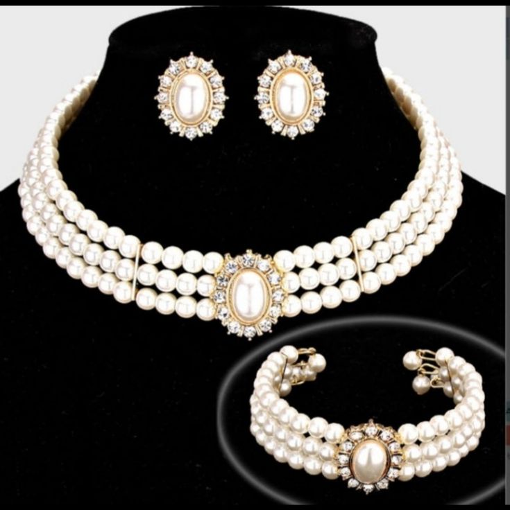 Gorgeous Rhinestone Trimmed Pearl Necklace Three-Piece Necklace Set. Perfect For Bride, Bridal Party & Any Special Occasion. Description: Necklace Size: 11 + 3 L Decor Size: 1 L Bracelet Size: 1 H / Cuff Earrings Size: 1 L This Item Is Non-Returnable Vintage Pearl Necklace Set, Luxury Festive Jewelry Sets With Pearl Drop, Royal Accessories Necklace, Luxury Festive Temple Necklace With Pearl Drop, Pearl And Diamond Necklace Set, Pearl Choker Wedding, White Pearl Choker, Formal Necklace, Groom Flower