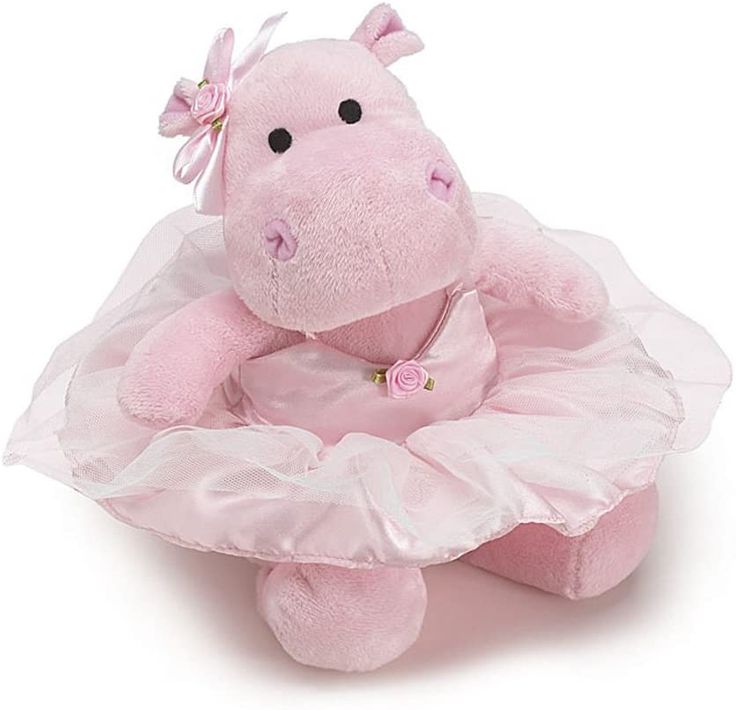 a pink stuffed animal in a tutu skirt