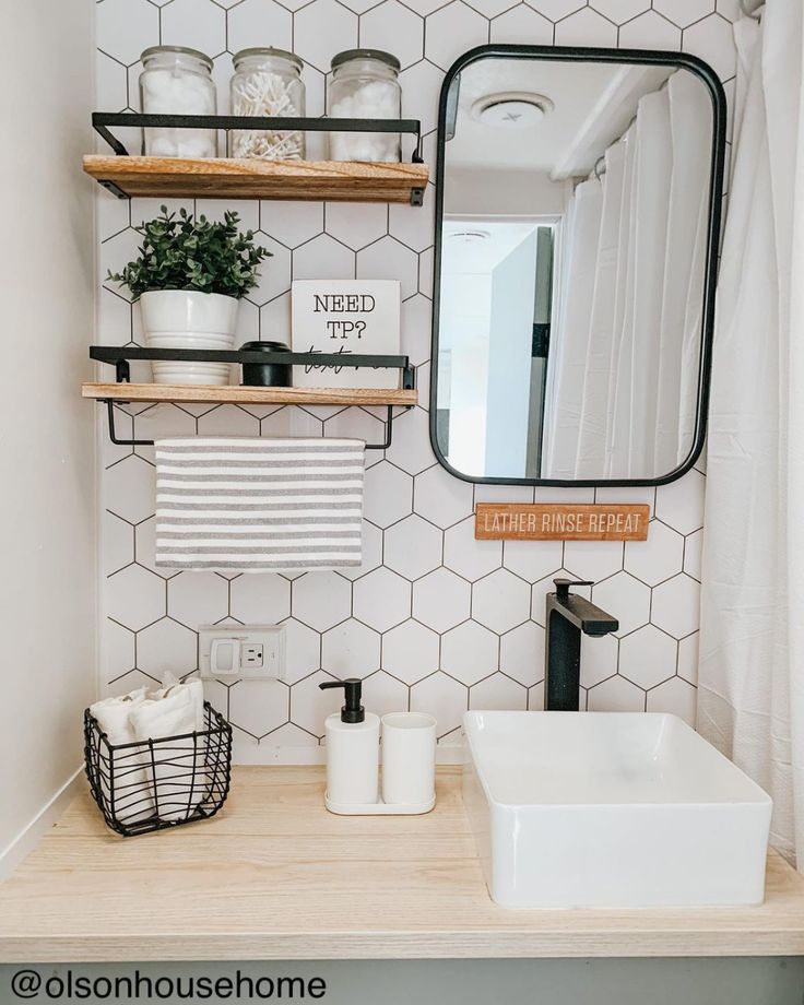 the bathroom is clean and ready to be used as a storage area for towels, toiletries and other items