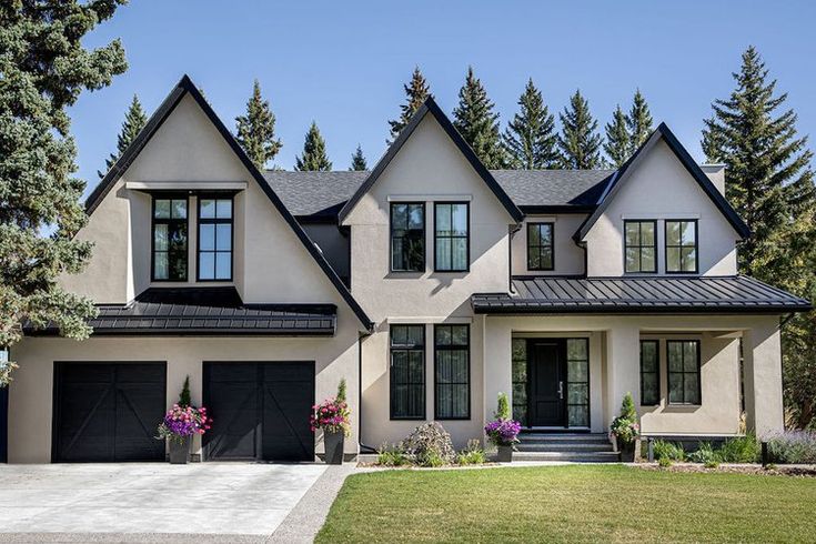 a white house with black trim and windows