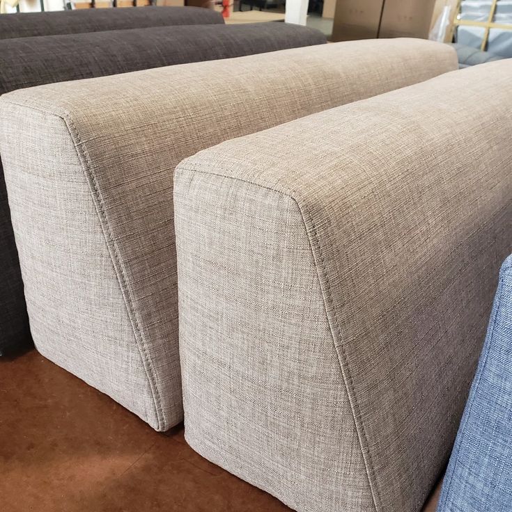 three different colored couches sitting next to each other