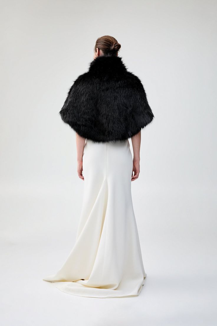 Dress the party: receive 20% off when purchasing four or more bridal styles. Use code BRIDAL20 at checkout. Luxurious and chic, this gorgeous cape is made from the most premium faux fur and features a wide collar with a concealed hook & eye closure in the front. Perfect for a black-tie event or regular wear, this cozy cape is the perfect layering piece for a girl with ethical fashion in mind. This garment is a one-size-fits-all. Elegant Evening Outerwear With Faux Fur Trim, Chic Evening Fur Coat With Faux Fur Trim, Elegant Party Outerwear With Faux Fur Lining, Formal Fur Coat With Feather Trim, Elegant Formal Fur Coat With Faux Fur Trim, Elegant Evening Fur Coat With Faux Fur Trim, Elegant Faux Fur Outerwear With Feather Trim, Elegant Party Outerwear With Faux Fur Trim, Elegant Outerwear With Faux Fur Trim For Party