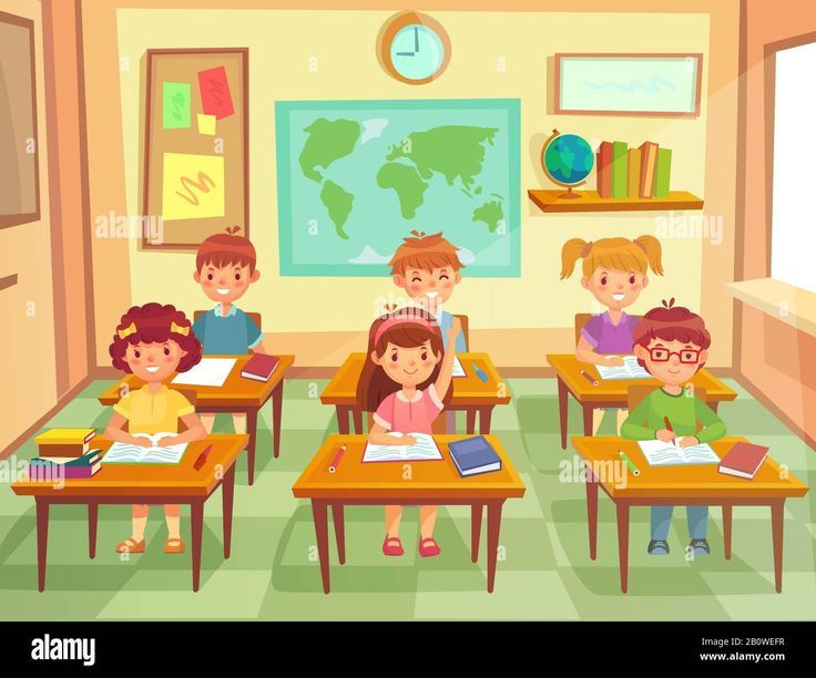 children sitting at desks with books in classroom