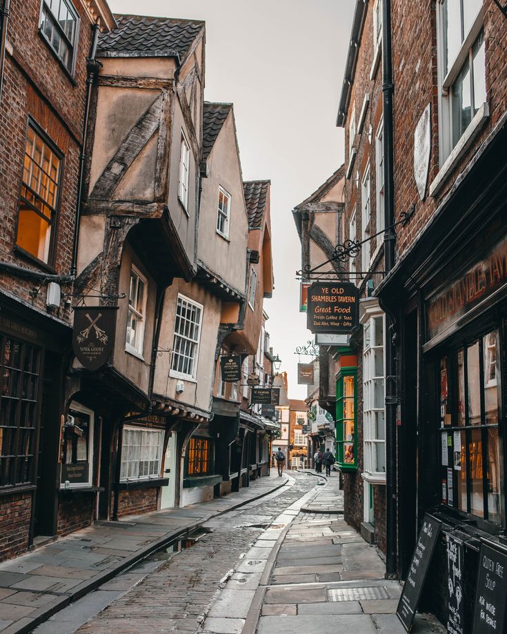 a narrow street with old buildings on both sides