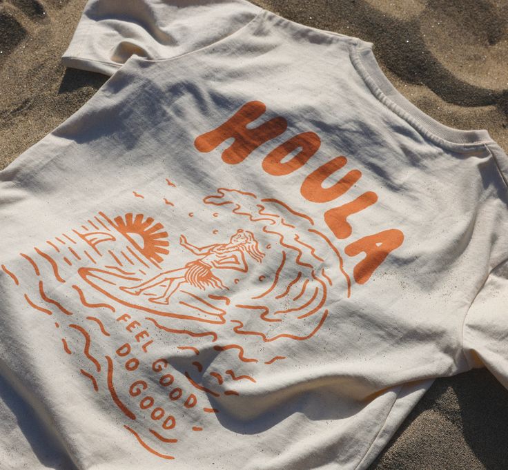 Aloha! This relaxed, flowy tee is perfect for summer days. The tropical print is sure to turn heads, and the soft cotton fabric is comfortable to wear all day long. #hawaiian #top #summer / #Cartagena #Groovy_Graphic_Tee #Summer_Tees_Graphics #Surf_Tshirt_Design_Ideas Surf Tshirt Design Ideas, Tee Shirts Design, T Shirt Graphics, Surf Tee Shirt, Hawaiian Top, Surf Graphic, Surf Tee, Us When, Surf Tshirt