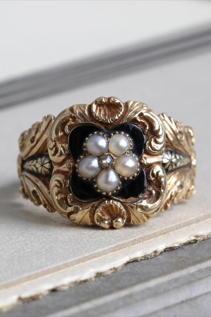 Antique yellow gold ring with black enamel and a pearl flower in the center, surrounded by a floral scroll pattern. Georgian Rings Antique, Georgian Engagement Ring, Pirate Wedding, Sunburst Ring, Antique Gold Rings, Georgian Ring, Georgian Jewelry, Rings Vintage, Scroll Pattern