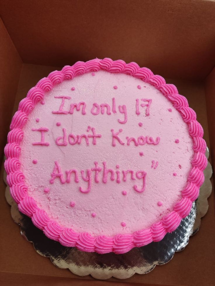 a pink frosted cake in a box that says i'm only if i don't know anything