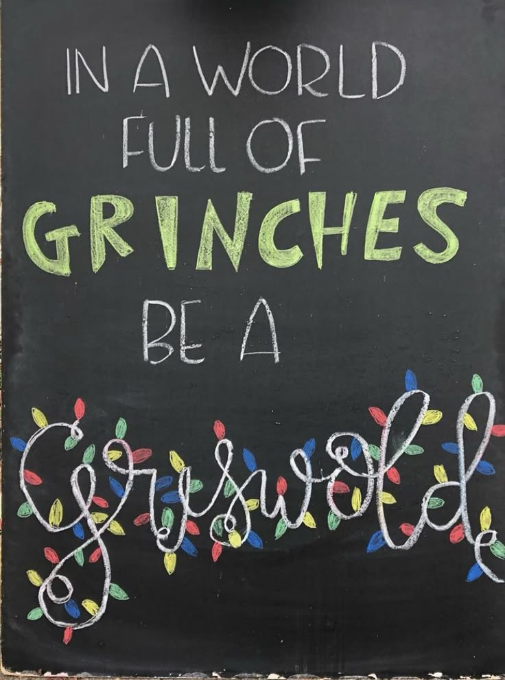 a chalkboard sign that says in a world full of grinches be a grisbee