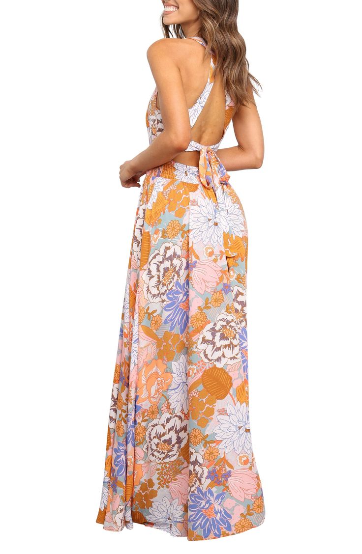 Step out in stunning, boho-chic style in this floral-print maxi dress flaunting a tie at the open back and a smocked waist for definition. Ties behind back; back button closure Sleeveless Partially lined 100% rayon Hand wash, dry flat Imported Gown Skirt, Halter Maxi Dress, Halter Maxi, Floral Print Maxi Dress, Floral Print Maxi, Halter Maxi Dresses, Boho Chic Fashion, Printed Maxi Dress, Nordstrom Dresses