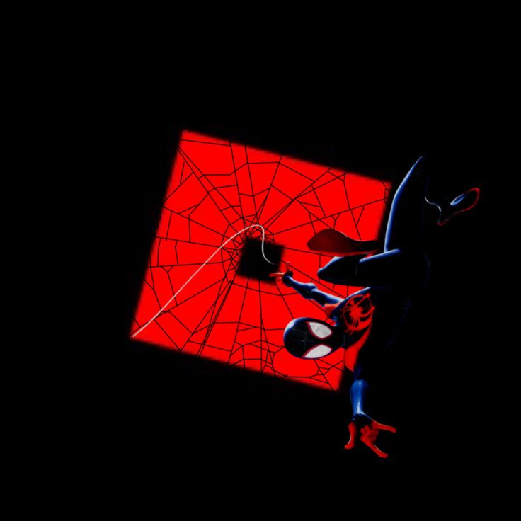 a spider - man hanging upside down in the dark