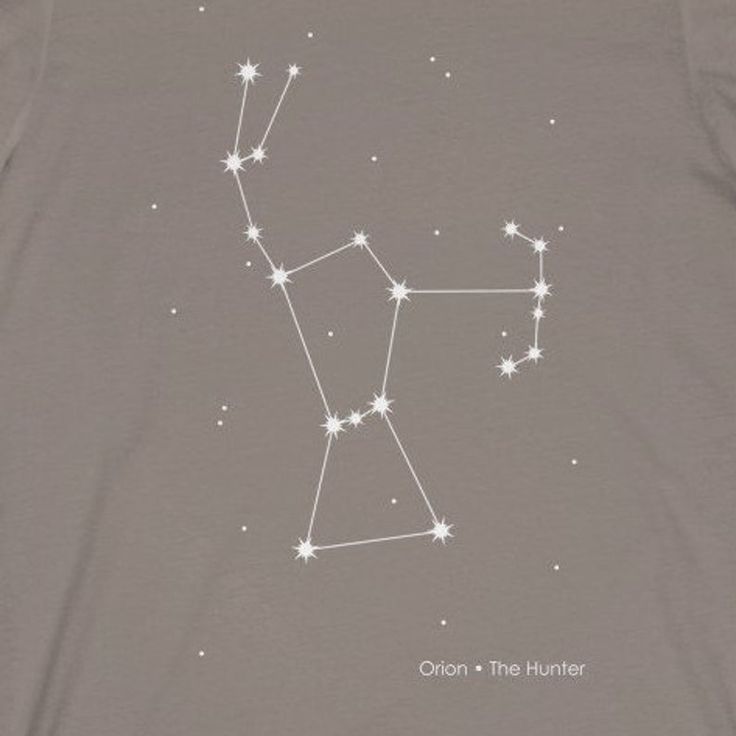 a t - shirt with the zodiac sign on it's chest and stars in the sky