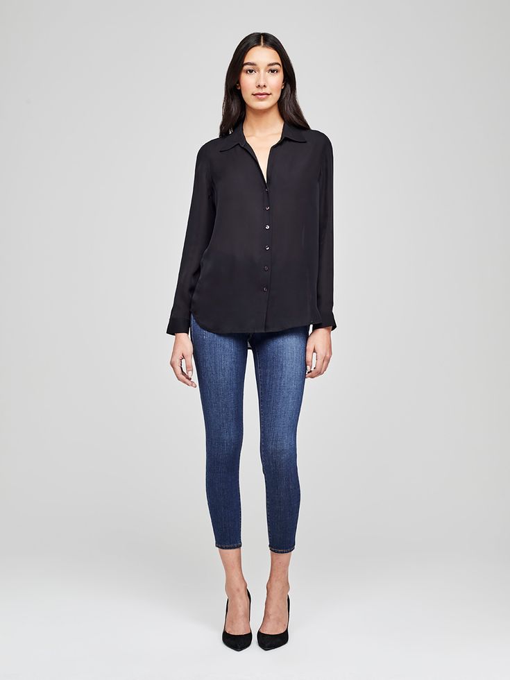 A modern classic. The Nina blouse is structured in all the right places with a relaxed, flattering fit. Refined button-down construction with a chic open collar and draped long sleeve in black silk. Sleek Button-up Blouse For Business Casual, Sleek Collared Blouse For Fall, Sleek Spring Blouse With Button Closure, Sleek Collared Blouse For Business Casual, Sleek Business Casual Blouse For Fall, Sleek Blouse With Button Cuffs For Business Casual, Sleek Business Casual Blouse With Button Cuffs, Silk Blouse With Shirttail Hem For Work, Sleek Semi-formal Blouse For Fall