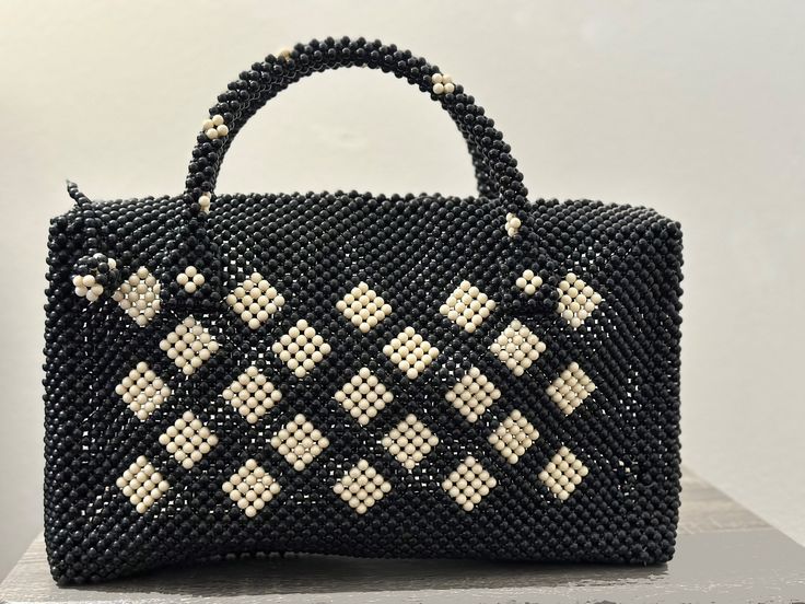 Introducing our exquisite collection of beaded handbags, where artistry meets functionality in perfect harmony. Luxury Handheld Beaded Shoulder Bag, Elegant Handwoven Shoulder Bag, Elegant Handmade Rectangular Shoulder Bag, Elegant Square Handmade Shoulder Bag, Luxury Beaded Bags For Everyday Use, Elegant Handmade Rectangular Bag, Elegant Beaded Top Handle Bag, Elegant Handmade Rectangular Bags, Luxury Handmade Tote Evening Bag