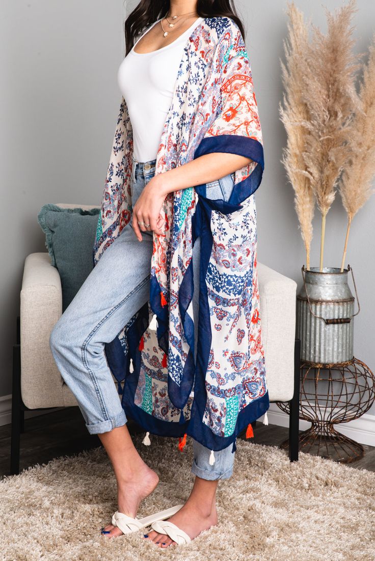 Get ready to make a statement with our Alina Paisley Floral Patchwork Kimono! Perfect for any occasion, this kimono features vibrant paisley and floral prints, creating a unique and eye-catching look. With its lightweight and flowy design, it's the perfect addition to your wardrobe. Perfect for both beaches and festivals! 100% Viscose One Size Fits Most 0-14 Length: 38" Bust: 36" Patterned Flowy Kimono With Kimono Sleeves, Bohemian Patterned Kimono With Vibrant Print, Red Bohemian Flowy Kimono, Long Flowy Patterned Kimono, Casual Summer Kimono With Paisley Print, Flowy Patterned Kimono For Festivals, Casual Summer Paisley Print Kimono, Festival Flowy Patterned Kimono, Long Summer Kimono With Paisley Print