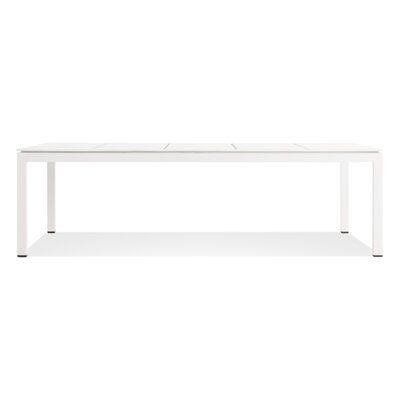 a white table on a white background with no one around it and the top off