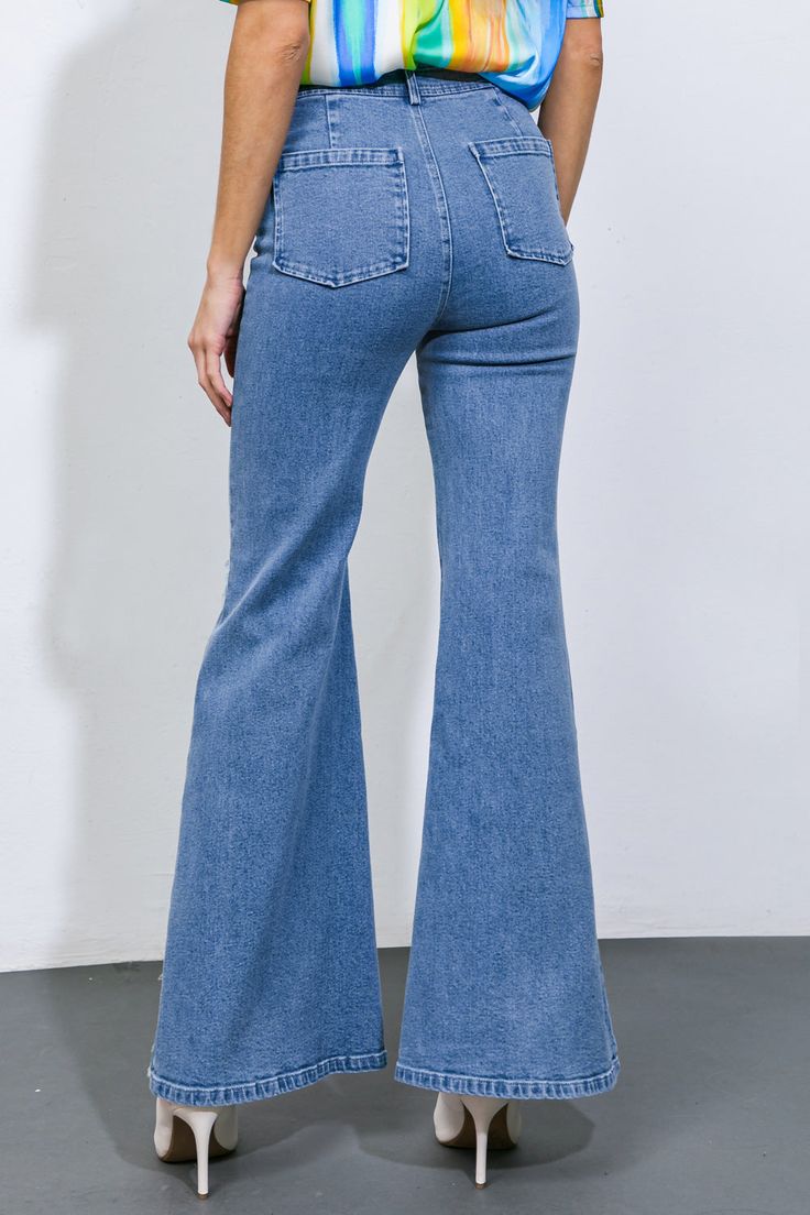 A pair of denim pants, washed to perfection, with a front closure and multiple pockets, and a flattering flare leg finished with trendy fray detailing.Details:Self : 80% Cotton 20% PolyesterSize & Fit- Model is 5`10" And Wearing Size Small- Measurements Taken From Size Small- Approx. Length: 44" High Rise Blue Flares With Five Pockets, Denim Blue Flare Jeans With Five Pockets, Blue Flare Jeans With Five Pockets, High Rise Dark Wash Denim Flares, Denim Flares With Five Pockets, Trendy Full-length Medium Wash Flares, Light Wash Flare Jeans For Fall, Flare Light Wash Jeans For Fall, High Waist Medium Wash Flares With Five Pockets