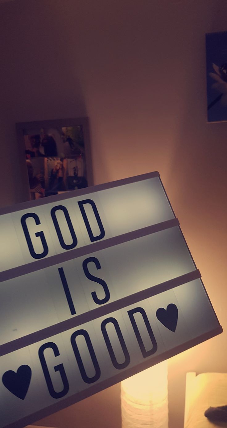 a light up sign that says god is good