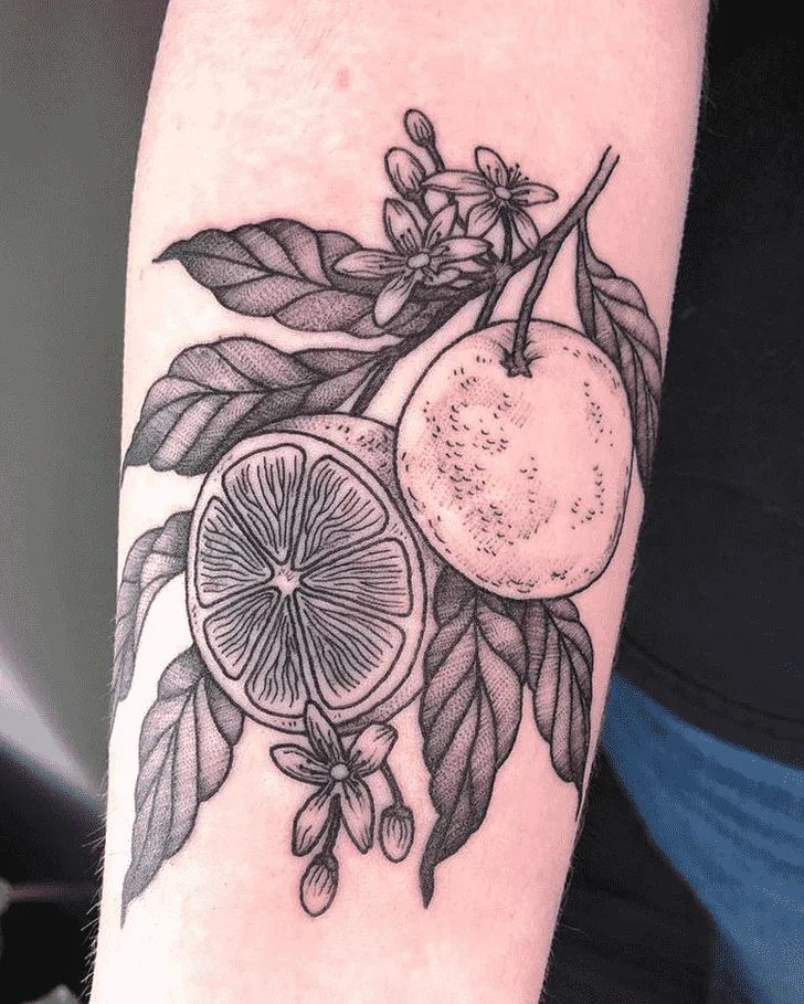 a black and white tattoo with fruit on it