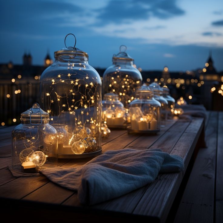 several glass jars filled with lights on top of a wooden table