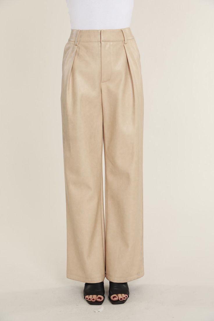 Elevate your professional outfits (or even just your everyday looks) with an edgy wardrobe staple like our Faux Leather Wide Leg Trouser Pants. Tailored to perfection, these wide legged trousers offer a relaxed yet polished vibe, ideal for curating a smart casual look. The sleek faux leather material lends a modern edge, while the wide leg cut ensures a comfortable, airy feel. Pair these with a crisp blouse or a casual tee to create versatile looks that transition effortlessly from office hours Edgy Wardrobe, Wide Legged Trousers, Pants Tailored, Smart Casual Look, Professional Outfits, Casual Tee, Trouser Pants, Cool Suits, Leather Material