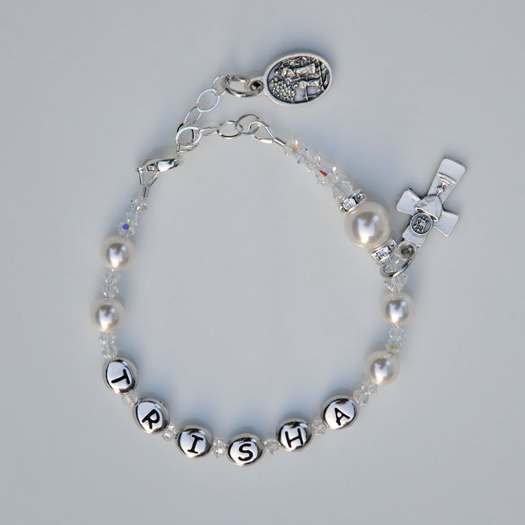 Personalized Custom Name First Holy Communion Swarovksi Sparkly White Crystal Pearl Rosary Bracelet Sterling Adjustable Sizing for Girls What girl wouldn't love to receive a beautiful Swarovski crystal pearl bracelet personalized with her own name to celebrate her First Holy Communion? The sterling silver extender chain allows the bracelet to grow with her, ensuring many years of wearability long after her special day. Each of the 6mm white crystal pearls represents a Hail Mary prayer. If you ch Adjustable Silver Pearl Bracelet For Birthday, Personalized Adjustable Pearl Bracelet For Mother's Day, Silver Pearl Bracelet With Pearl Charm For Mother's Day, Silver Beaded Bracelets With Pearl Charm As Gift, Adjustable White Crystal Sterling Silver Bracelet, Adjustable Sterling Silver Beaded Bracelets With Pearl Charm, Personalized Rosary Bracelet For Birthday, Personalized Silver Beaded Bracelets For Birthday, Silver Beaded Bracelet With Name For Gift