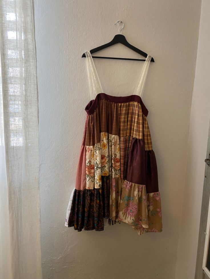 a dress hanging up against a wall