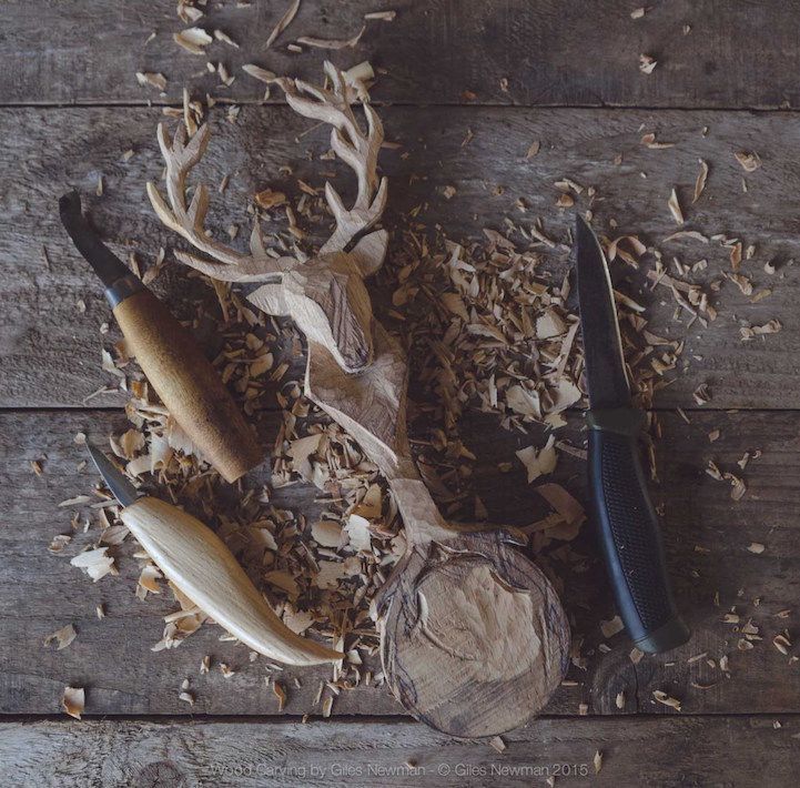 some wood shaving tools are laying on a wooden table next to it's contents