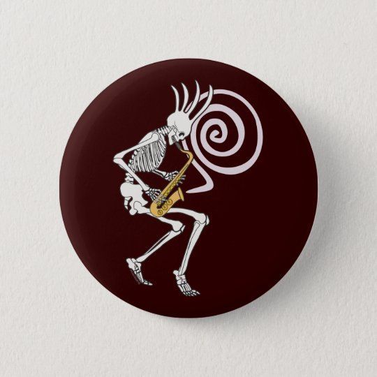 a button with a skeleton playing a guitar