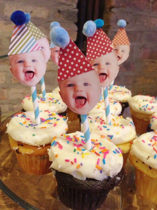 cupcakes with faces and candles on them