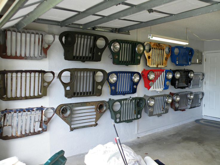 there are many different types of radiators hanging on the wall in this garage