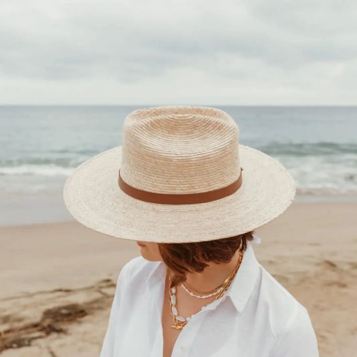 A little western and a little unexpected in the best ways - meet the Moonlight straw rancher, a statement hat that's not just for country concerts and riding horses. Part of our premium straw hat collection, the Moonlight is handcrafted with fine tripilla palm straw that's been sustainably harvested by artisans in Puebla, Mexico. Wear this straw hat for a long day outdoors, offering UPF 50+ sun protection and a large, structured, 4" brim to help shield your face from harmful rays. The cattleman style crown and toasted caramel straw color, gives the Moonlight that special western feel - complete with a removable, 100% genuine leather hatband with a gold hardware finish. Each handmade hat is unique and may have small imperfections or vary in size and color. • Organic and Plastic-free • Produ Adjustable Handwoven Straw Hat For Rodeo, Brimmed Straw Hat For Ranch, Brimmed Toquilla Straw Hat For Ranch, Brimmed Toquilla Straw Ranch Hat, Summer Braided Boater Hat In Toquilla Straw, Summer Braided Toquilla Straw Boater Hat, Country Style Natural Hat Bands For Summer, Flat Brim Woven Straw Hat For Rodeo, Woven Flat Brim Straw Hat For Rodeo