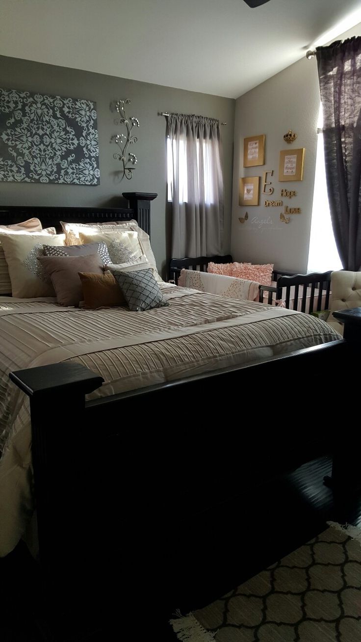 a bedroom with a large bed and lots of pillows