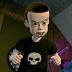 a young boy with a creepy face holding a toothbrush in one hand and wearing a t - shirt with a skull on it