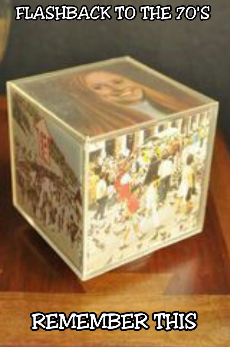 a plastic box with pictures on it sitting on top of a wooden table