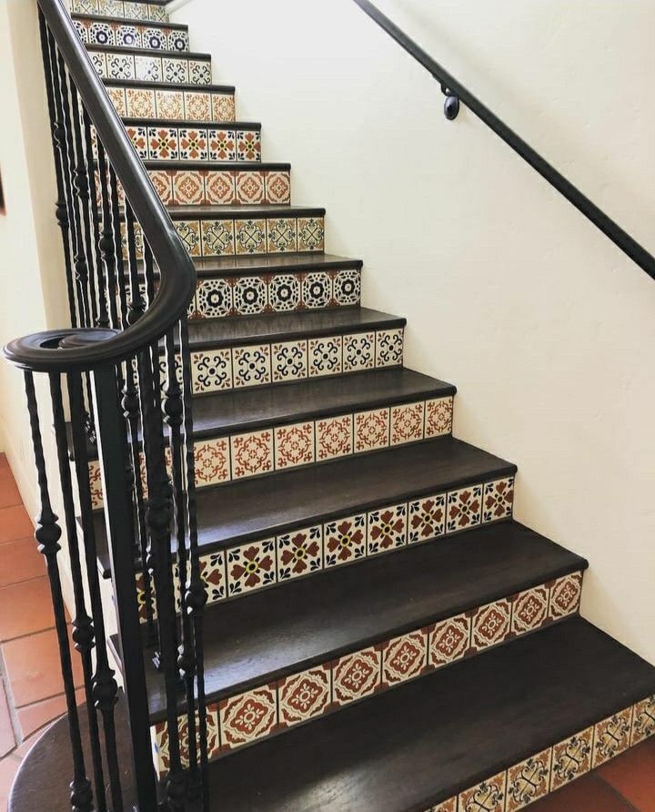 a set of stairs with decorative tiles on them