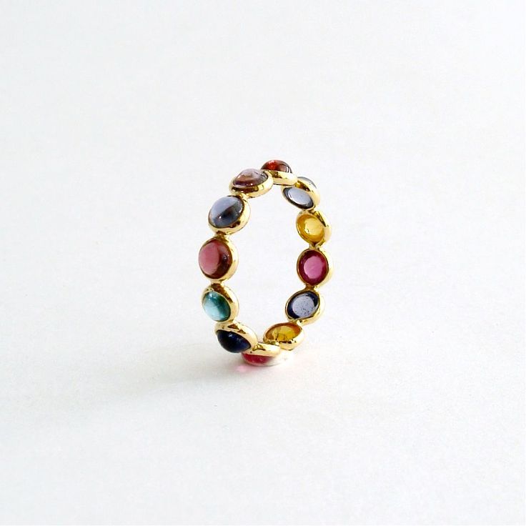 Sparkling multi colored tourmaline cabochons have been bezel set in 14k gold and linked to create this versatile stacking ring. Intriguing worn alone - it would also be stunning stacked with other eternity rings or gold band guards. US Size 6 Confetti Ring, Moonstone Pendant Necklace, Eternity Rings, Tourmaline Jewelry, Dope Jewelry, Gem Ring, Jewelry Lookbook, Moonstone Pendant, Jewelry Inspo