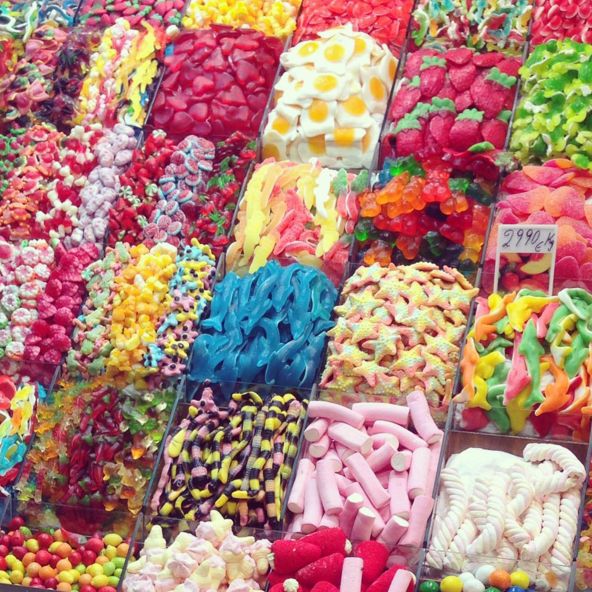 there are many different types of candies on display