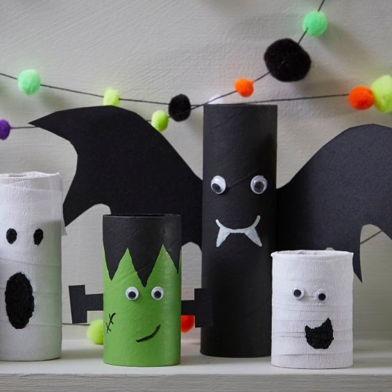 some toilet paper rolls are decorated to look like bats