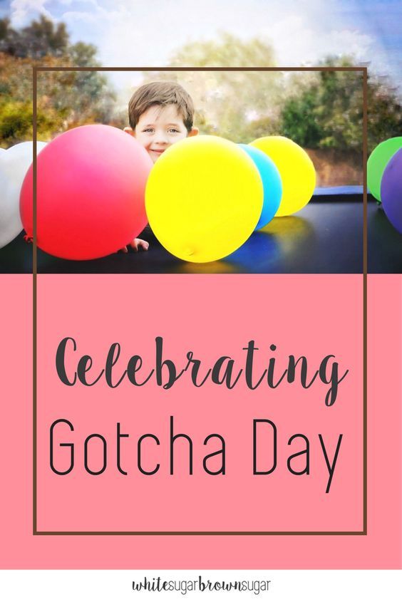 a young boy holding balloons with the words celebrating gotcha day in front of him