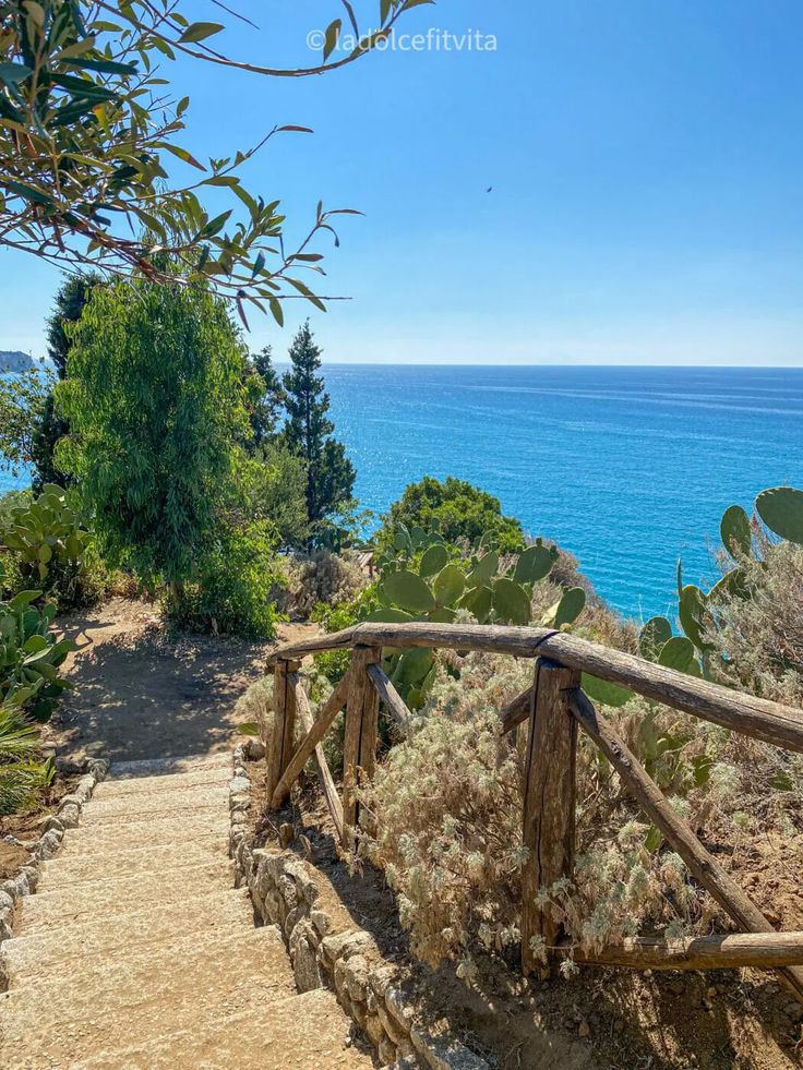 the stairs lead down to the beach and ocean